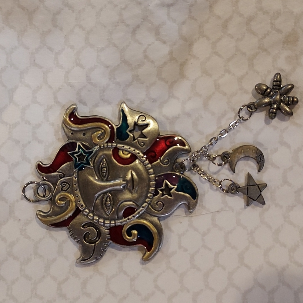 Enameled Sun Charm both sides are the same with moon star and snowflake charms